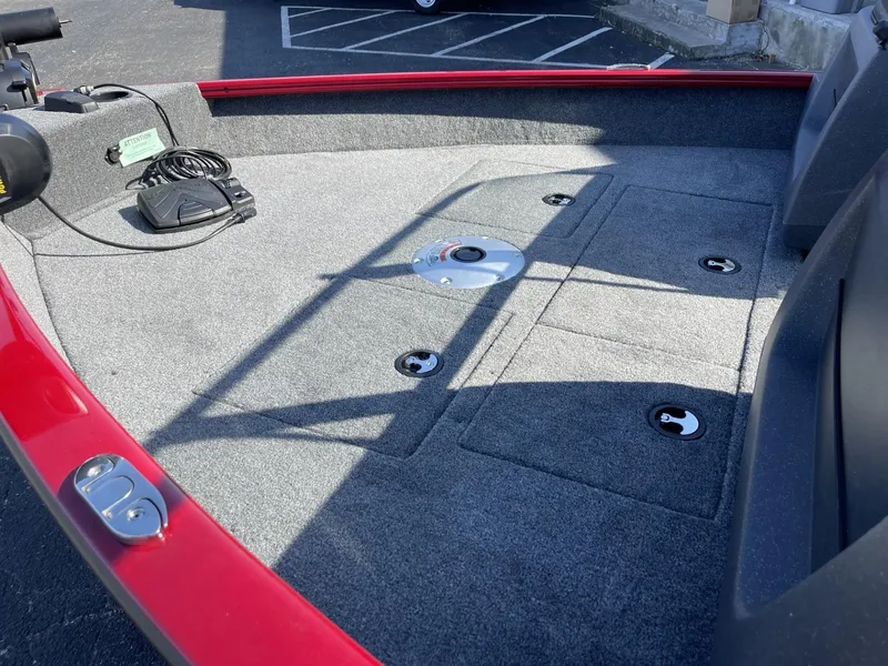 Slide: The Image of 2025 Tracker Pro Guide V-16 WT boat deck with storage compartments and trolling motor. - 7