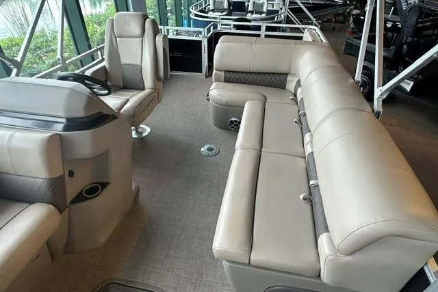 Slide: The Image of 2025 Sun Tracker Sportfish 24 XP3 interior with beige seating and modern design. - 3