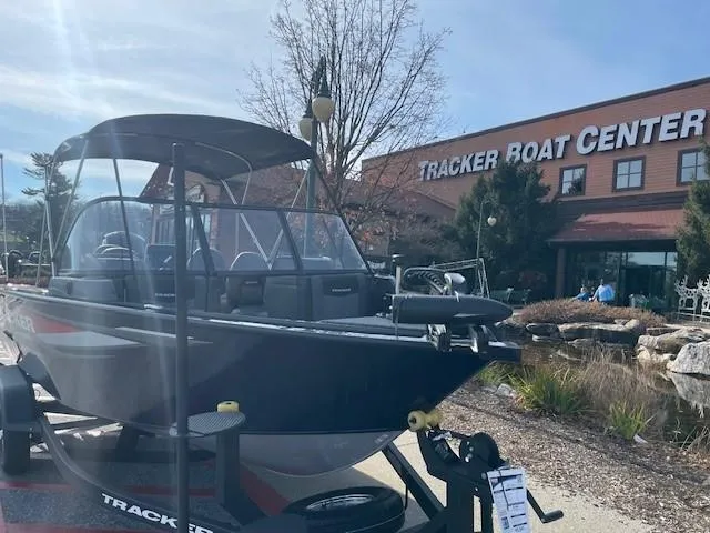 Slide: The Image of 2025 Tracker Targa V-18 WT boat displayed at Tracker Boat Center. - 2
