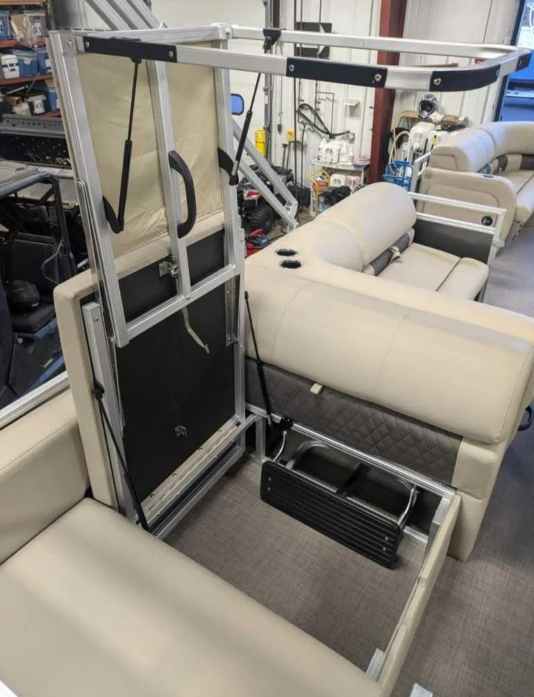 Slide: The Image of 2025 Sun Tracker Party Barge 22 RF DLX interior seating and storage area. - 4