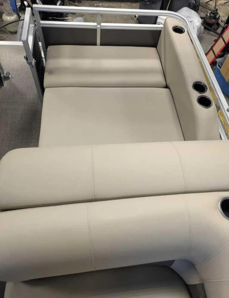 Slide: The Image of 2025 Sun Tracker Party Barge 22 RF DLX seating area with cup holders. - 5