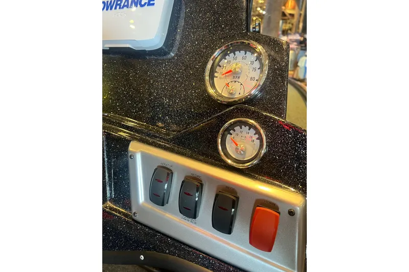 Slide: The Image of Dashboard of a 2025 Nitro Z19 boat with gauges and switches. - 10