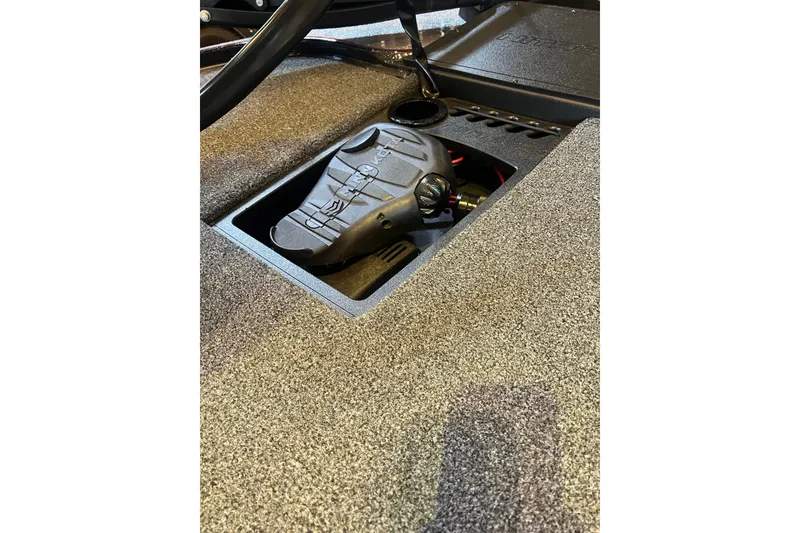 Slide: The Image of 2025 Nitro Z19 boat interior with pedal and textured flooring. - 13