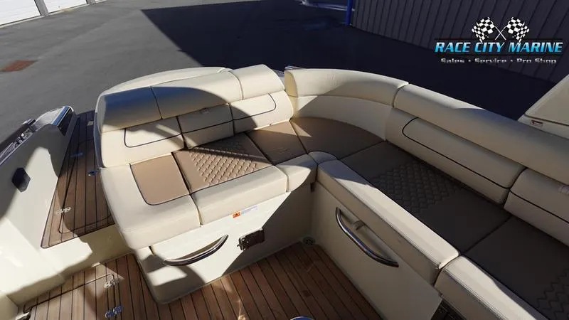 Slide: The Image of Luxurious seating on 2025 Chris-Craft 28GT boat with elegant design and wood flooring. - 17