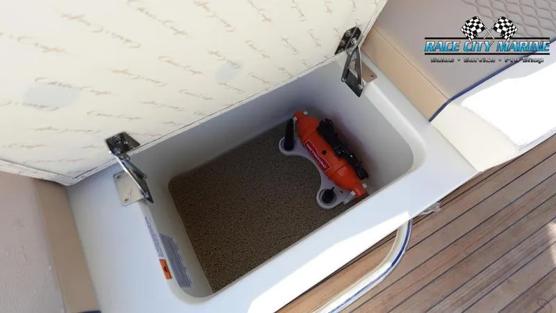 Slide: The Image of 2025 Chris-Craft 28GT storage compartment with safety equipment on a boat deck. - 21