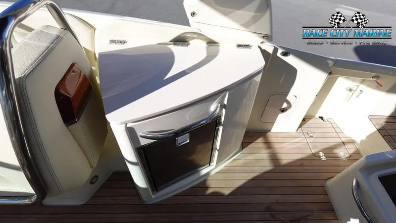 Slide: The Image of 2025 Chris-Craft 28GT boat interior with sleek cabinetry and wood flooring. - 25