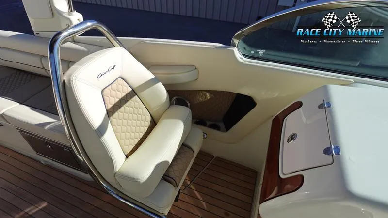 Slide: The Image of 2025 Chris-Craft 28GT boat interior with luxurious seating and wood flooring. - 28