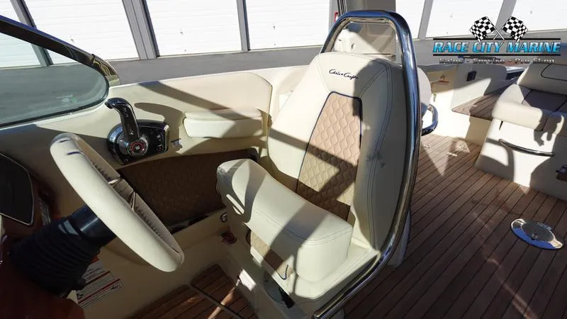 Slide: The Image of 2025 Chris-Craft 28GT boat interior with luxurious seating and steering wheel. - 35