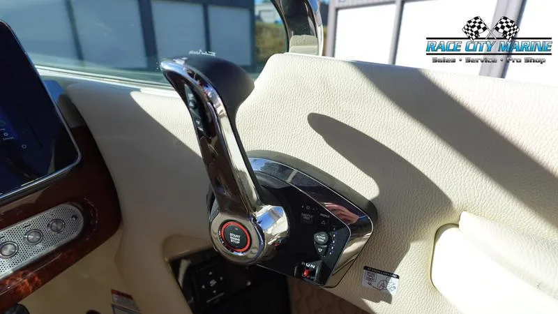 Slide: The Image of 2025 Chris-Craft 28GT throttle control in a luxury boat interior. - 37