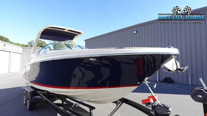Slide: The Image of 2025 Chris-Craft 28GT boat on trailer at Race City Marine dealership. - 4