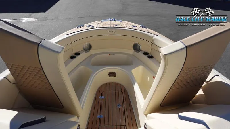 Slide: The Image of 2025 Chris-Craft 28GT boat interior with luxurious seating and wood accents. - 45