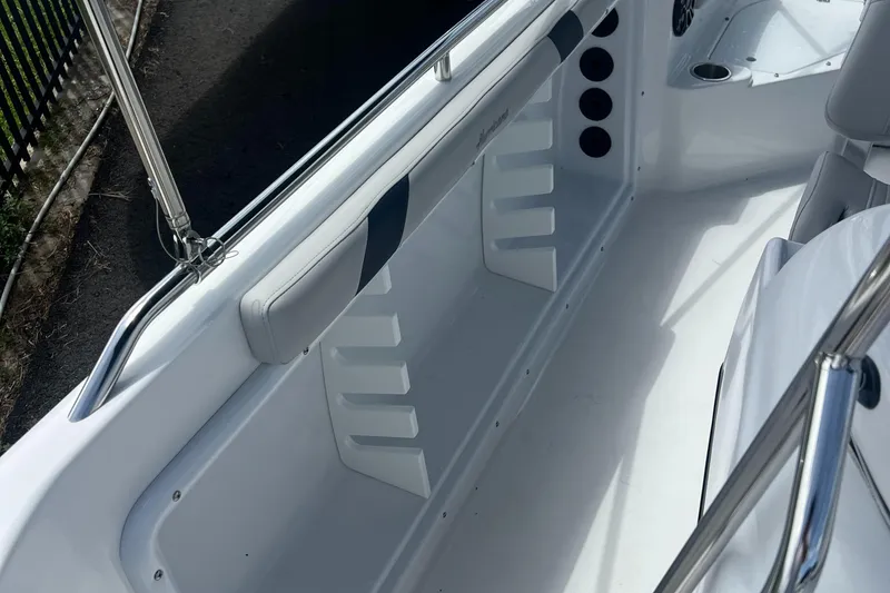 Slide: The Image of 2024 Hurricane Center Console SS 231 OB boat interior with sleek seating and storage. - 10