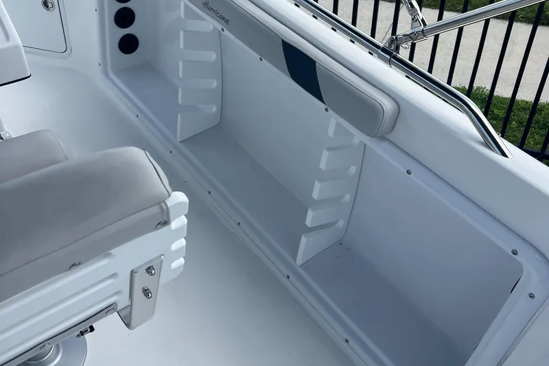 Slide: The Image of 2024 Hurricane Center Console SS 231 OB interior seating and storage area. - 13