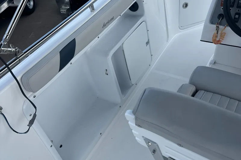 Slide: The Image of 2024 Hurricane Center Console SS 231 OB interior with seating and storage. - 14