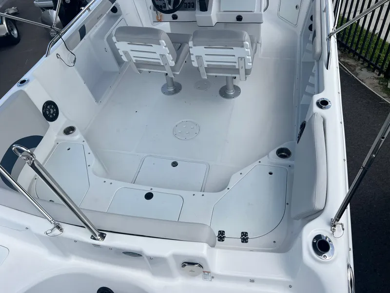 Slide: The Image of 2024 Hurricane Center Console SS 231 OB boat interior with seating and console. - 4