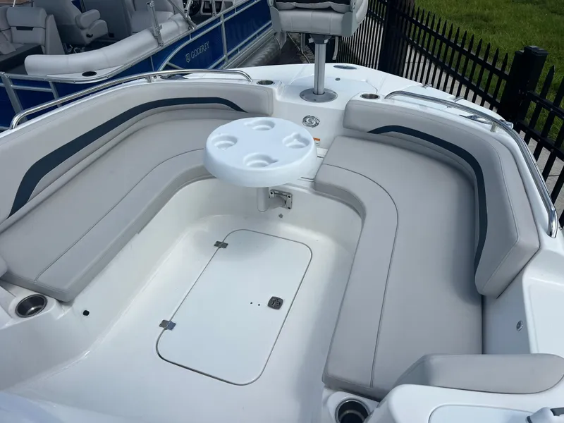 Slide: The Image of 2024 Hurricane Center Console SS 231 OB boat interior with seating and table. - 5