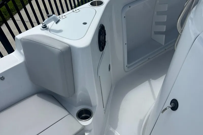 Slide: The Image of 2024 Hurricane Center Console SS 231 OB interior with seating and cup holders. - 7