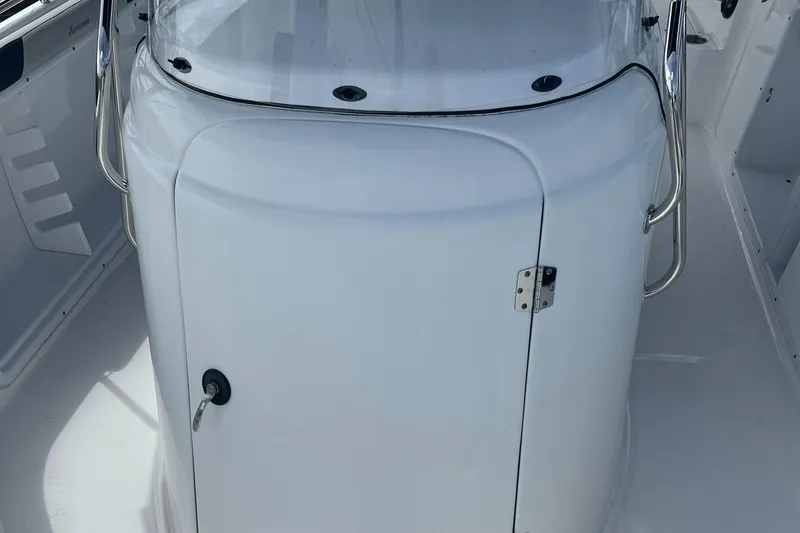 Slide: The Image of 2024 Hurricane Center Console SS 231 OB boat interior, featuring sleek white design. - 8