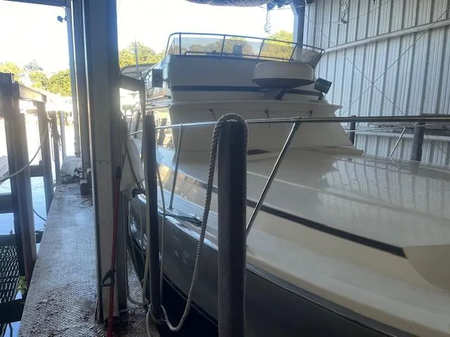 The Image of 1981 Viking 43 DC yacht docked in a covered marina. - 0