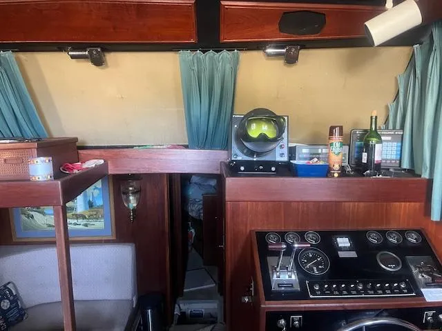 Slide: The Image of Interior of 1981 Viking 43 DC boat with control panel and nautical decor. - 11