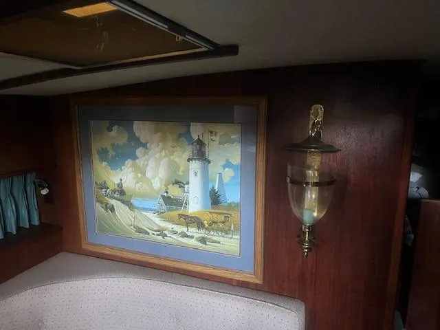 Slide: The Image of Interior of 1981 Viking 43 DC with lighthouse painting and wall sconce. - 12