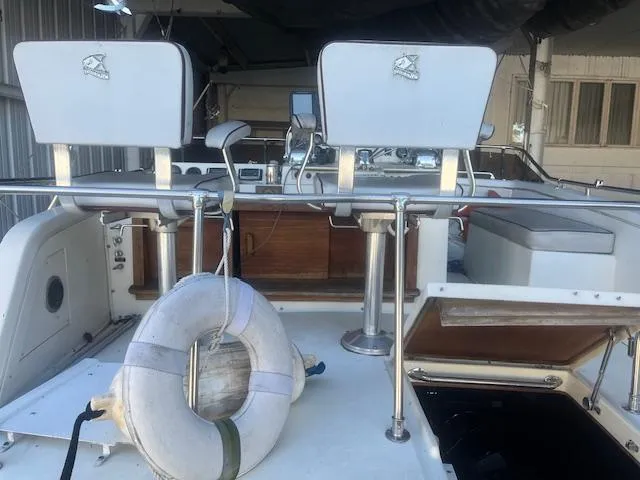 Slide: The Image of 1981 Viking 43 DC boat interior with helm, seats, and life preserver. - 26