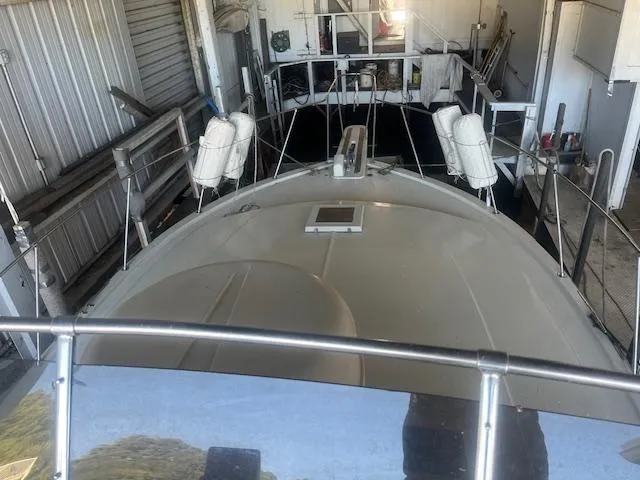 Slide: The Image of 1981 Viking 43 DC yacht docked in a storage facility. - 30