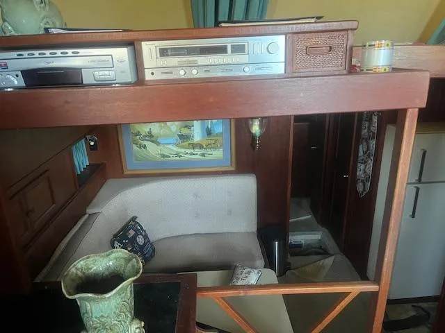 Slide: The Image of Interior of 1981 Viking 43 DC yacht with vintage stereo and cozy seating area. - 5