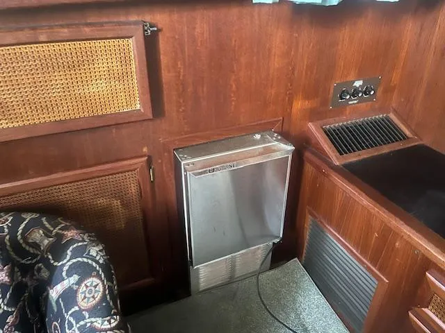 Slide: The Image of Interior of 1981 Viking 43 DC boat with wood paneling and metal heater. - 6