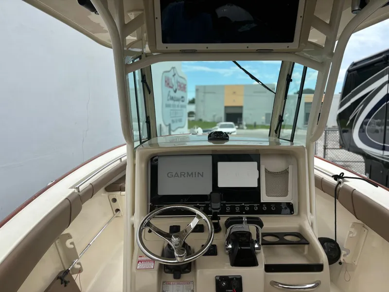 Slide: The Image of 2013 Scout 275 LXF boat helm with Garmin navigation system. - 13