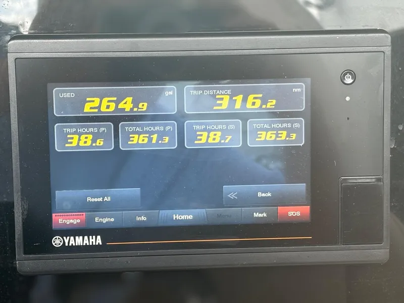 Slide: The Image of Yamaha display showing fuel usage and trip data for 2013 Scout 275 LXF boat. - 18
