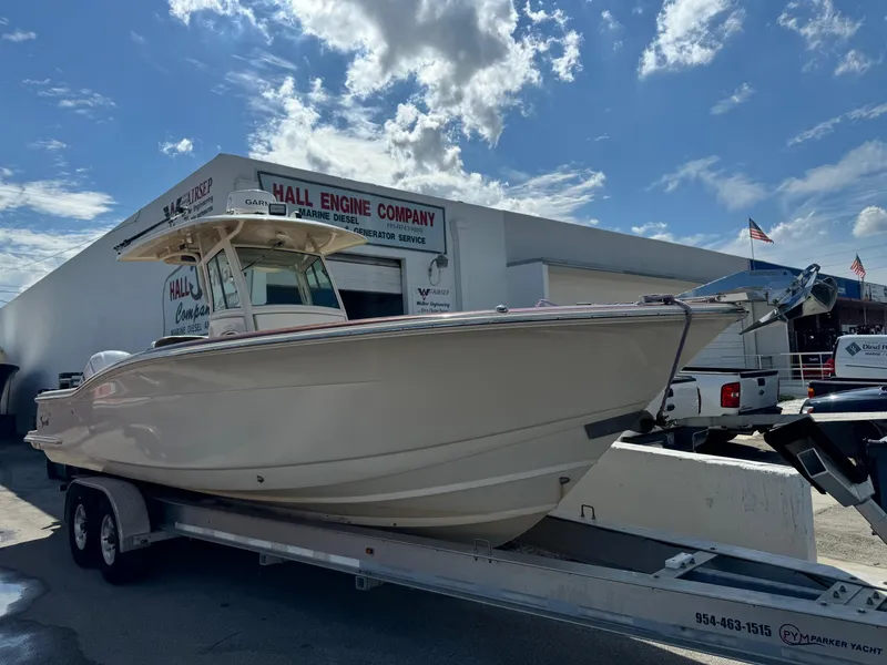 Slide: The Image of 2013 Scout 275 LXF boat on trailer outside Hall Engine Company. - 6