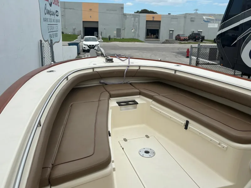 Slide: The Image of 2013 Scout 275 LXF boat with spacious seating and modern design. - 9