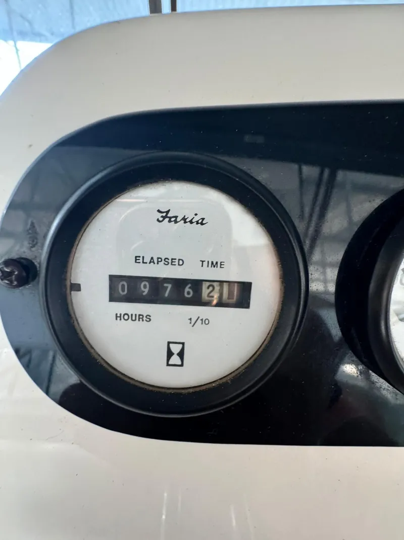 Slide: The Image of Elapsed time gauge on 1989 Sea Ray 39, showing 9762.1 hours. - 10