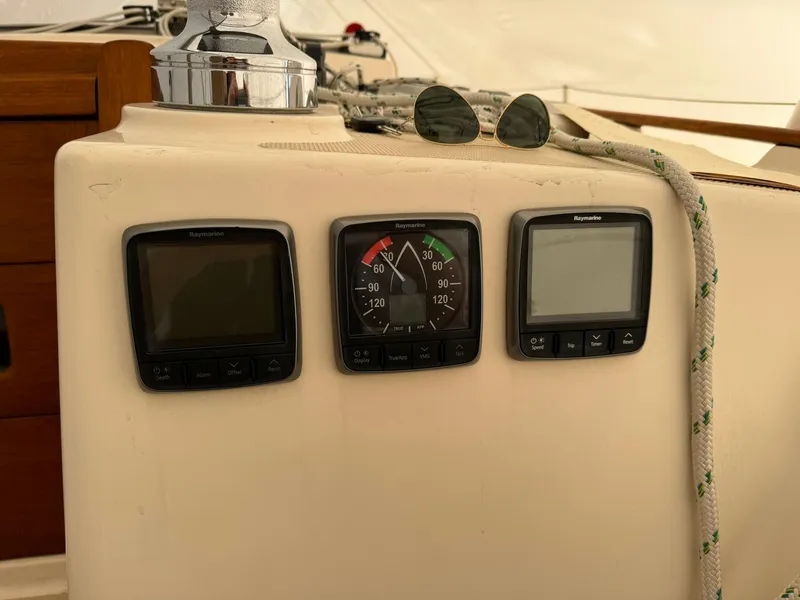 Slide: The Image of 1998 Island Packet 40 sailboat cockpit instruments and rope detail. - 16