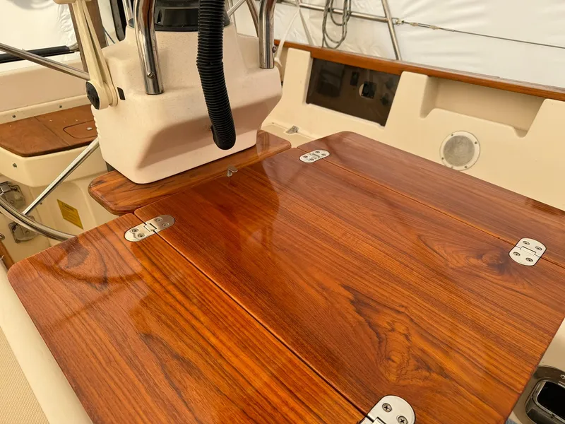 Slide: The Image of Polished wooden cockpit table on 1998 Island Packet 40 sailboat. - 21