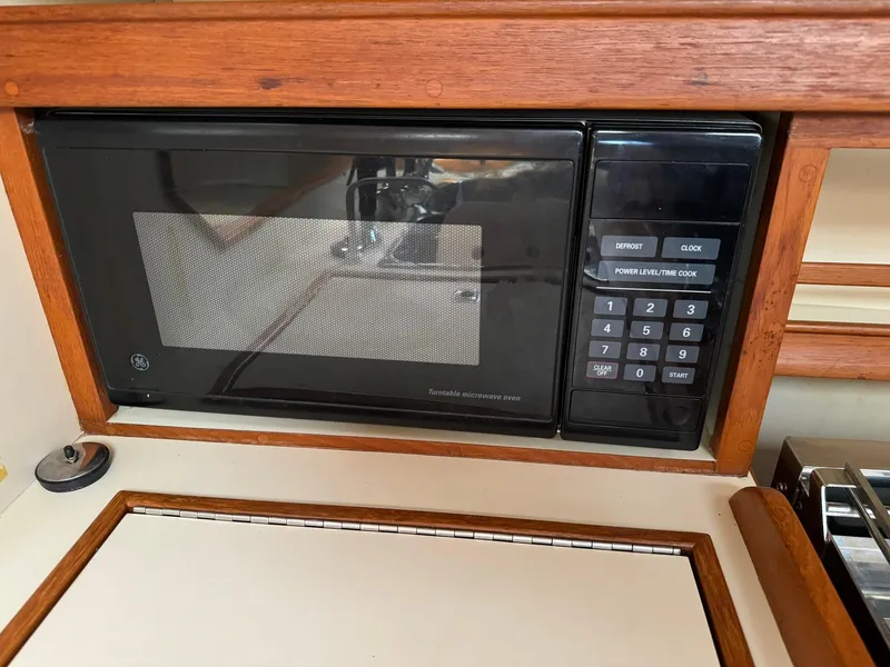 Slide: The Image of Built-in microwave in 1998 Island Packet 40 yacht kitchen. - 41
