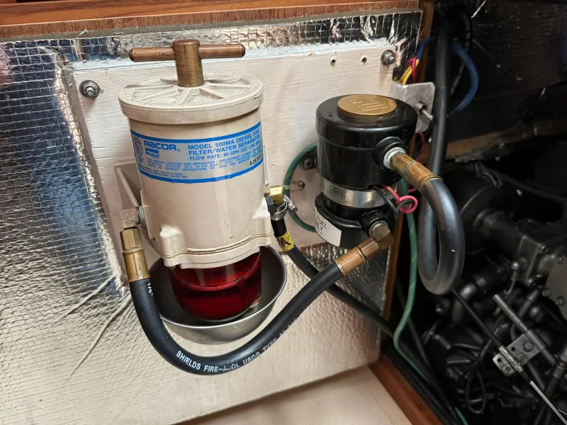 Slide: The Image of Fuel filter system on a 1998 Island Packet 40 sailboat engine compartment. - 42