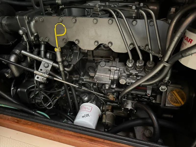 Slide: The Image of Engine of a 1998 Island Packet 40 sailboat, showcasing mechanical components. - 43