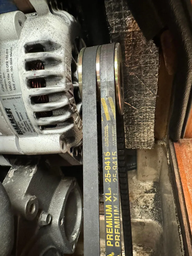 Slide: The Image of Close-up of engine belt and alternator in 1998 Island Packet 40 sailboat. - 48