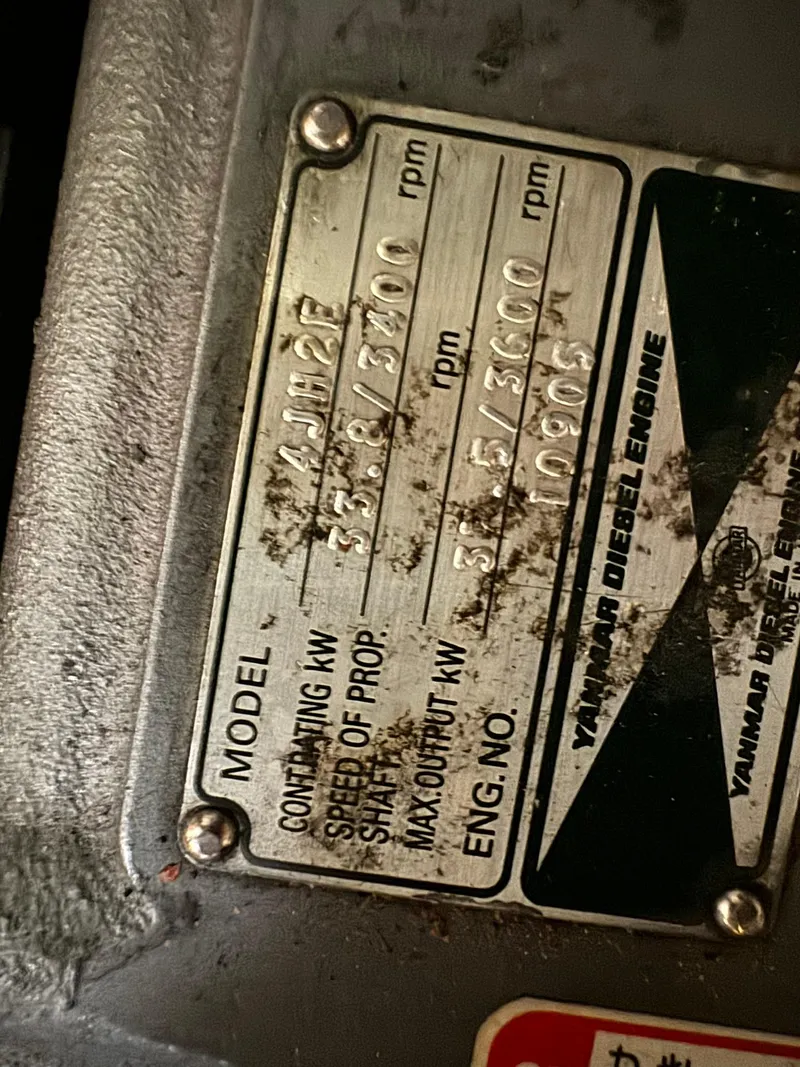 Slide: The Image of Yanmar diesel engine label on 1998 Island Packet 40 sailboat. - 49