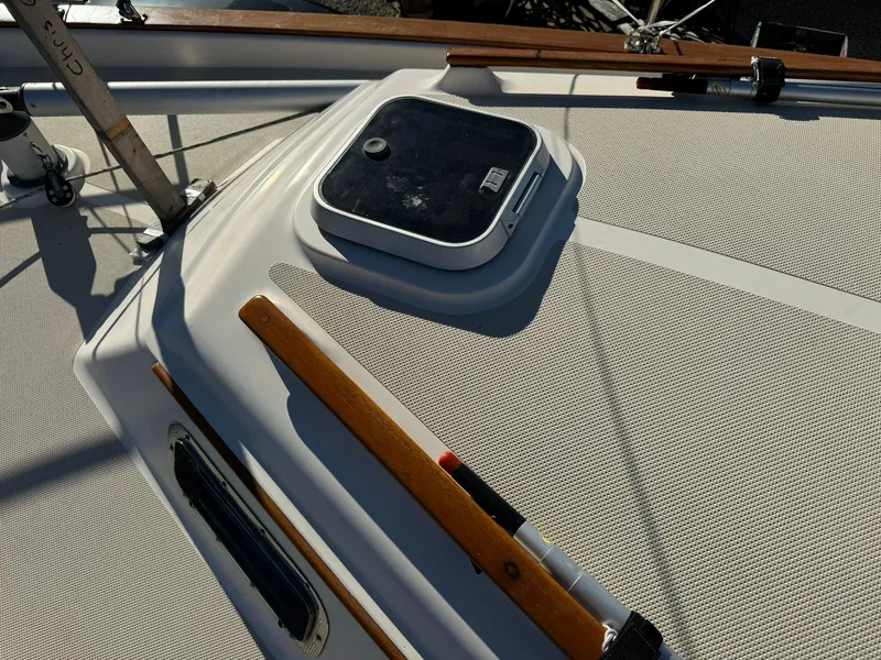 Slide: The Image of 1998 Island Packet 40 sailboat deck with hatch and wooden handrails. - 7