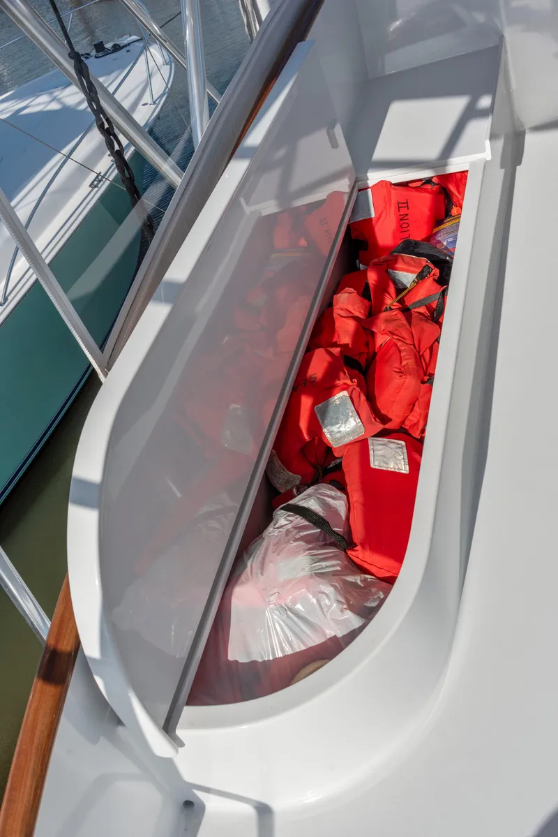 Slide: The Image of Life jackets stored on a 1963 Whiticar 54 Sportfisherman boat deck. - 10