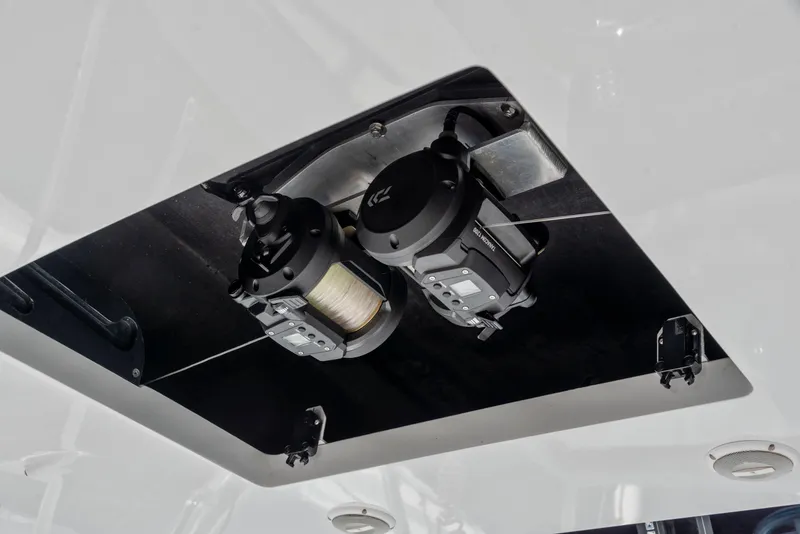 Slide: The Image of 1963 Whiticar 54 Sportfisherman fishing reel setup on deck. - 11