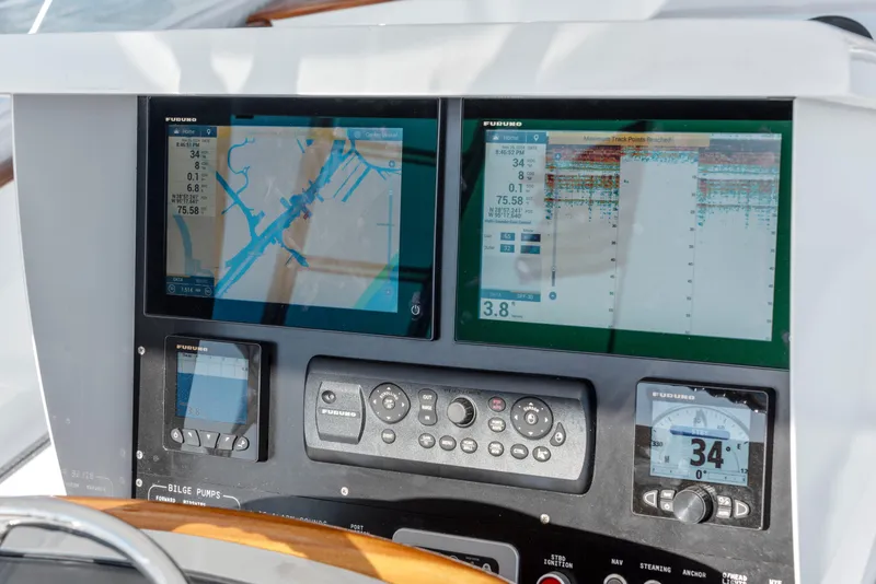 Slide: The Image of Navigation and control panel of a 1963 Whiticar 54 Sportfisherman boat. - 14