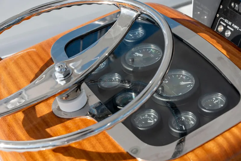 Slide: The Image of Steering wheel and dashboard of 1963 Whiticar 54 Sportfisherman boat. - 15