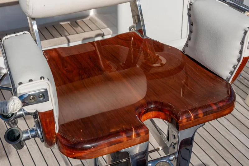 Slide: The Image of Polished wooden seat on 1963 Whiticar 54 Sportfisherman boat, showcasing craftsmanship and design. - 21