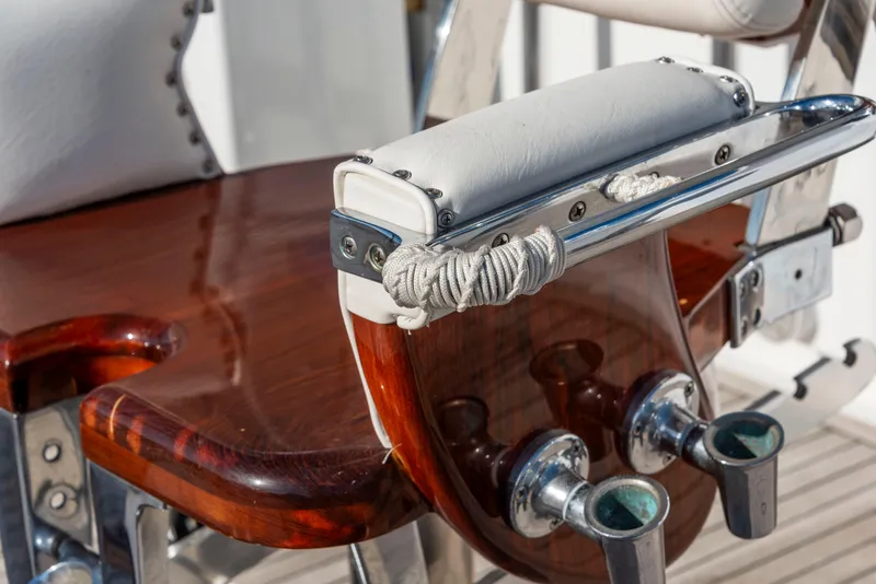 Slide: The Image of Vintage 1963 Whiticar 54 Sportfisherman chair with polished wood and metal details. - 22