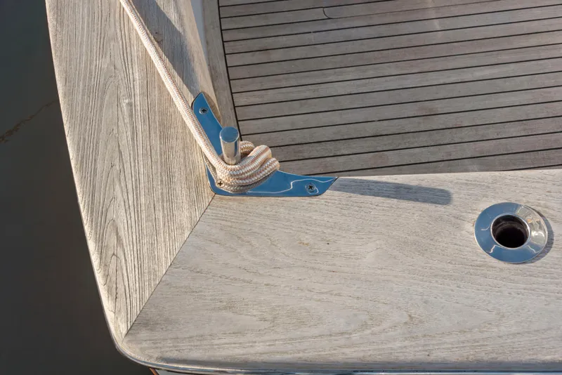 Slide: The Image of 1963 Whiticar 54 Sportfisherman boat deck with cleat and rope detail. - 24