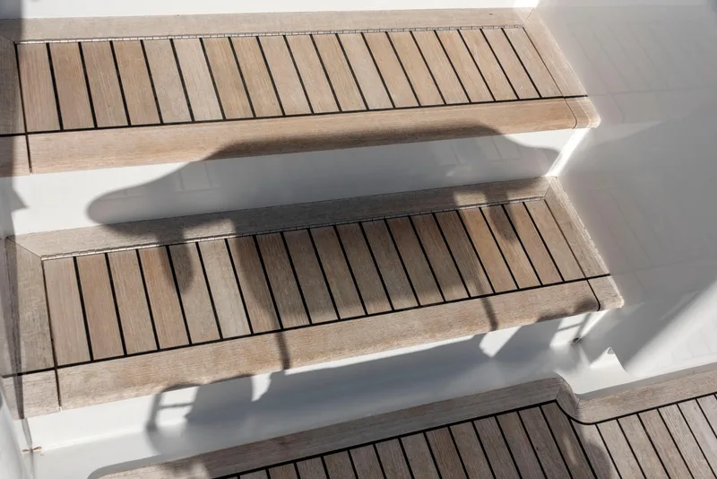 Slide: The Image of Wooden steps on a 1963 Whiticar 54 Sportfisherman boat, showcasing classic design. - 29